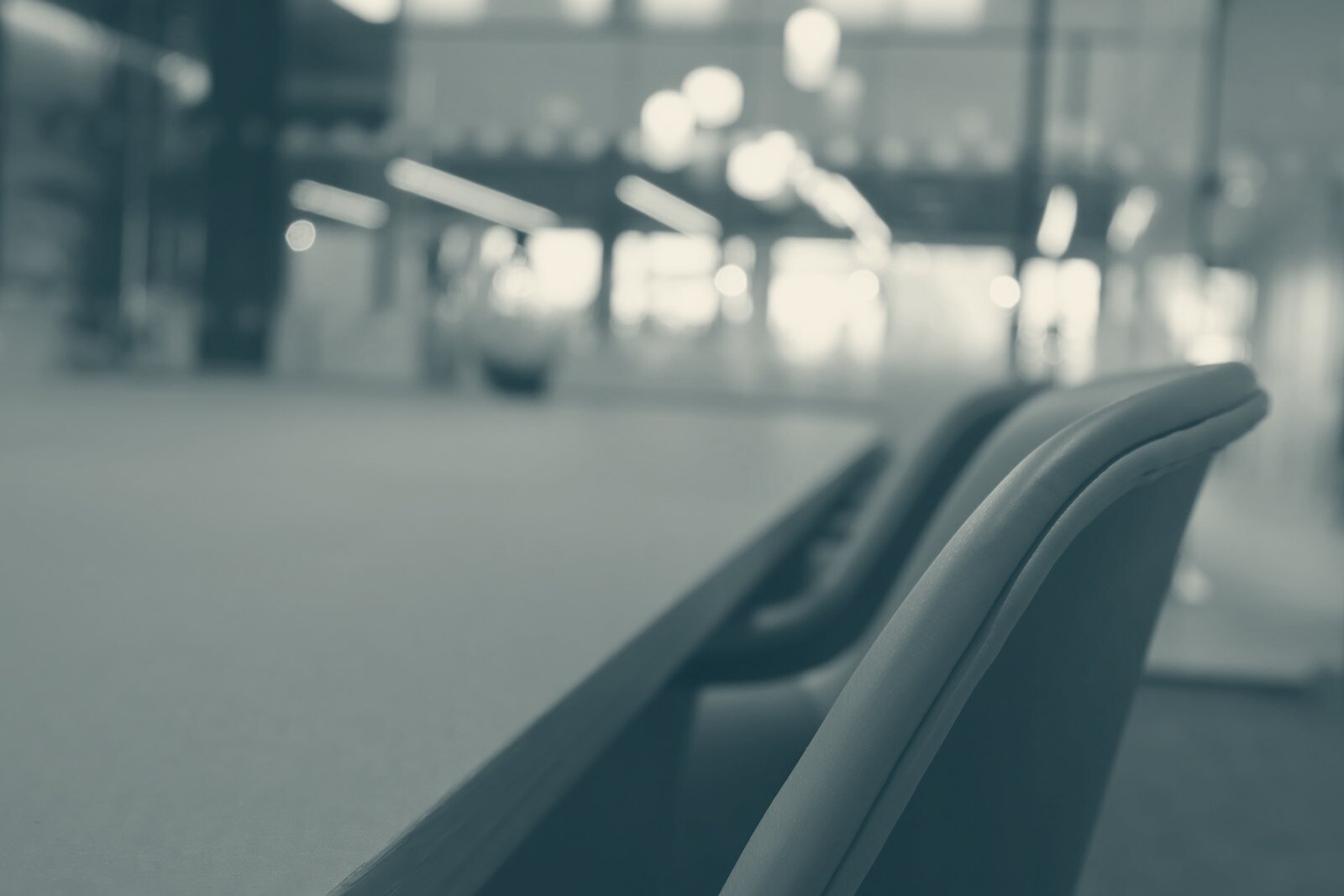 A close up of a table with a blurry building in the background